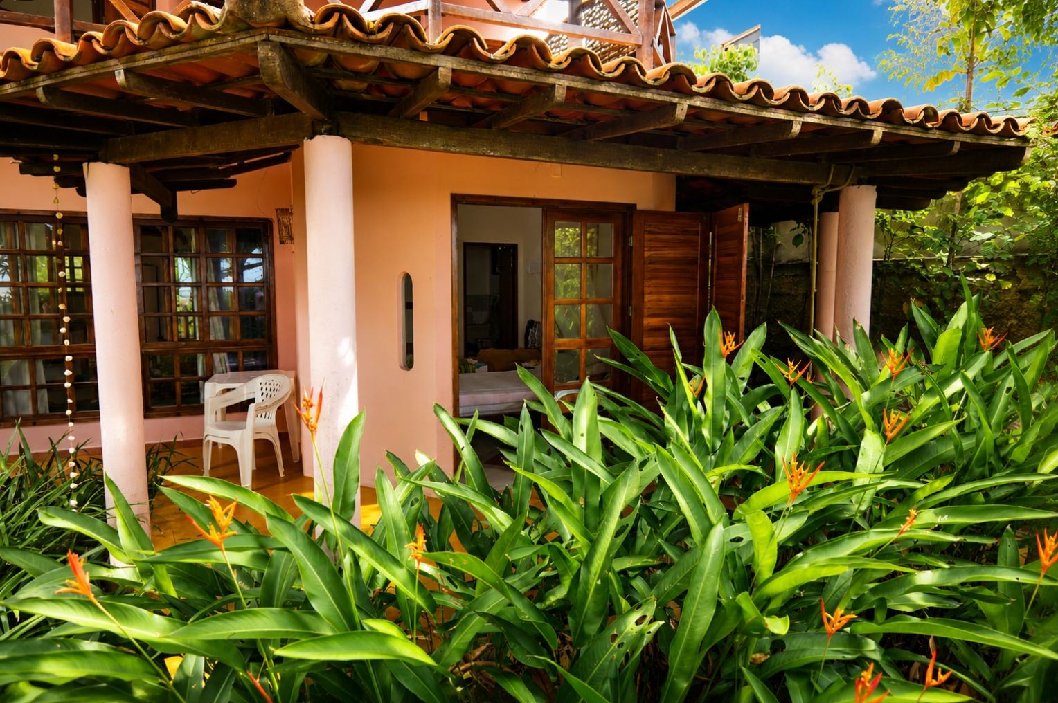 Veranda and tropical planting at the beach house