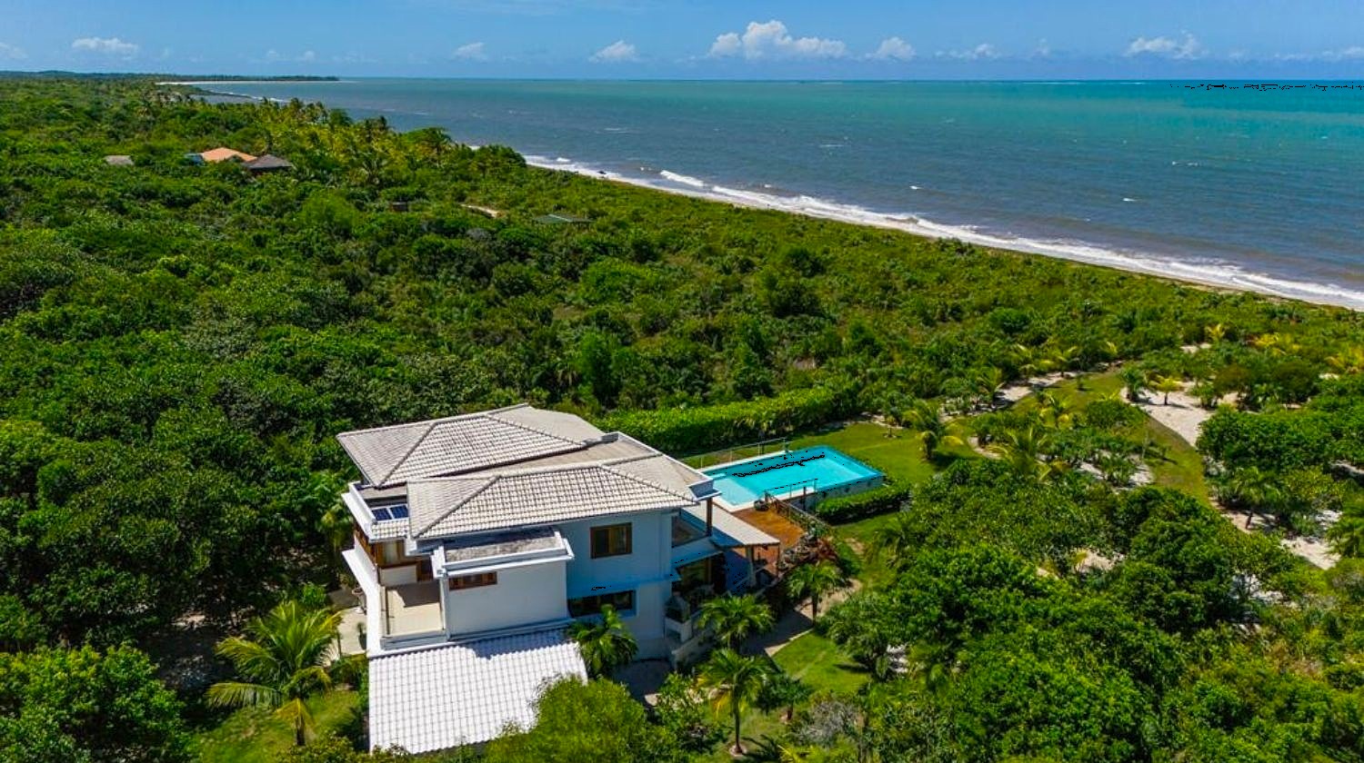 Aerial view of the villa in its tropical surroundings